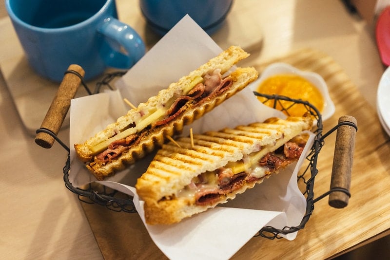 Paninis and dip at a restaurant